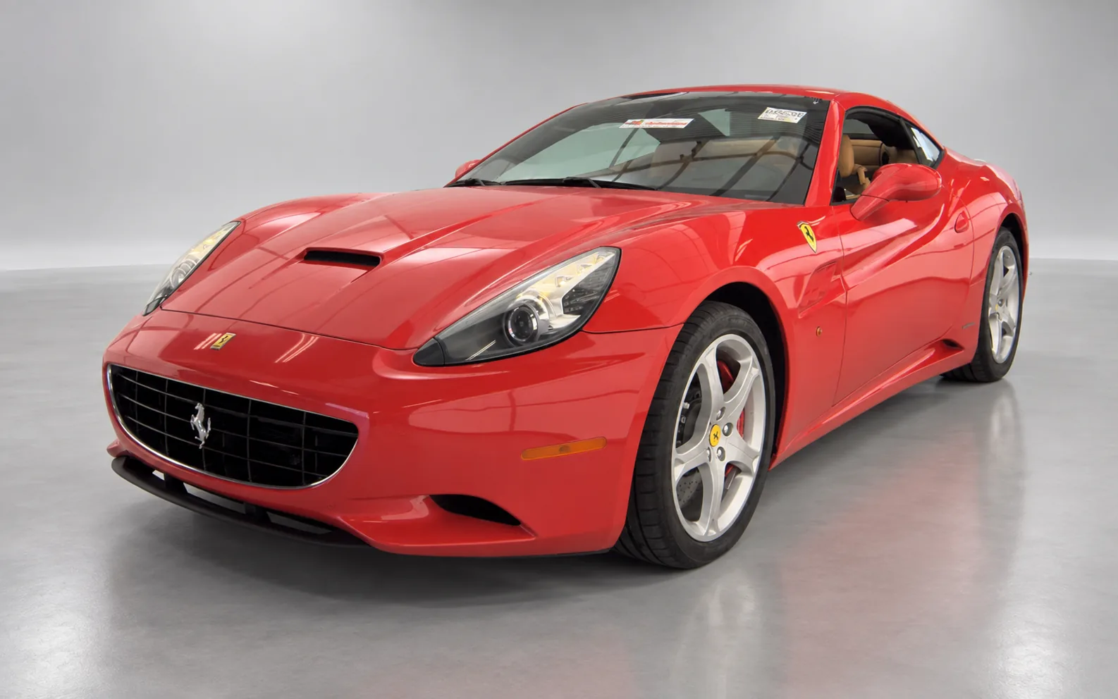 2010 Ferrari California, red, front three-quarter