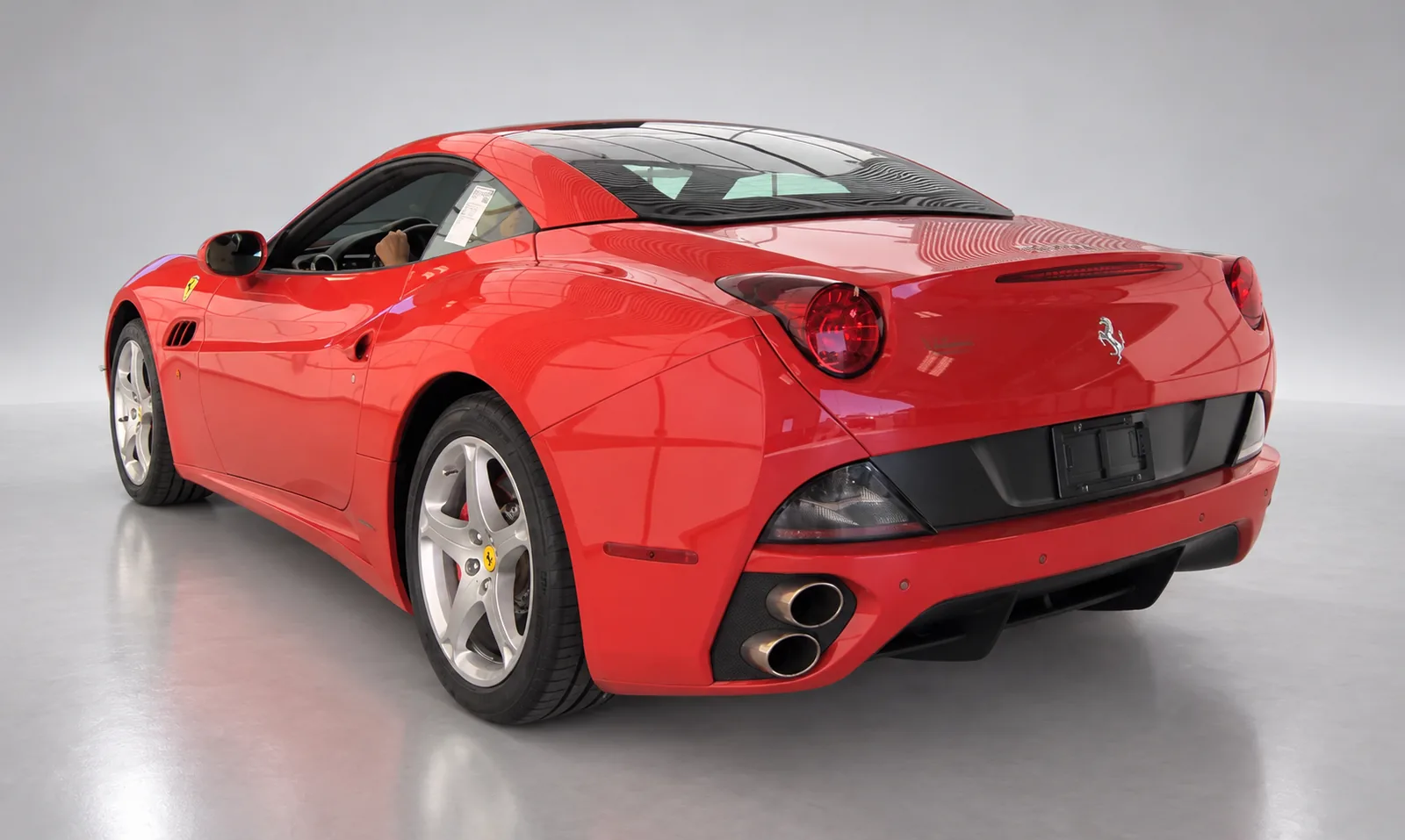 2010 Ferrari California, red, rear three-quarter left