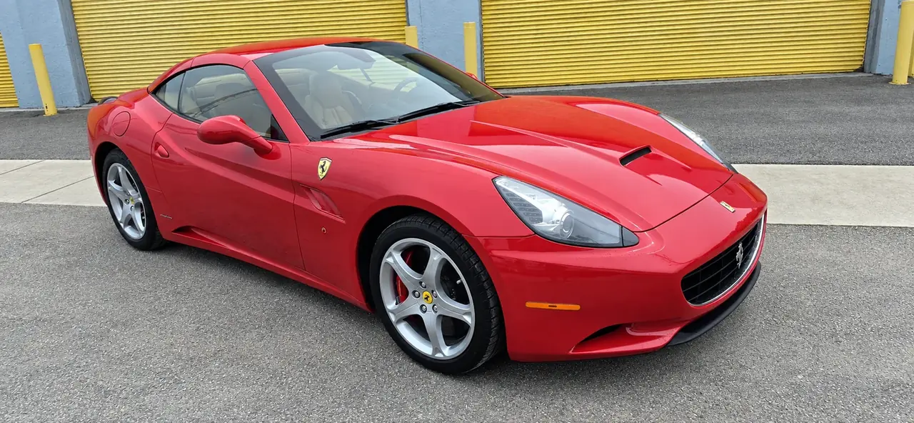 2010 Ferrari California, red, front three-quarter, roof up