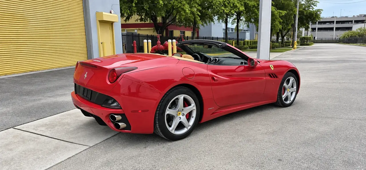 2010 Ferrari California, red, rear three-quarter, roof down
